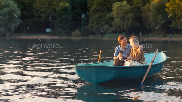Young couple at the lake Stock Photo by AboutImages | PhotoDune