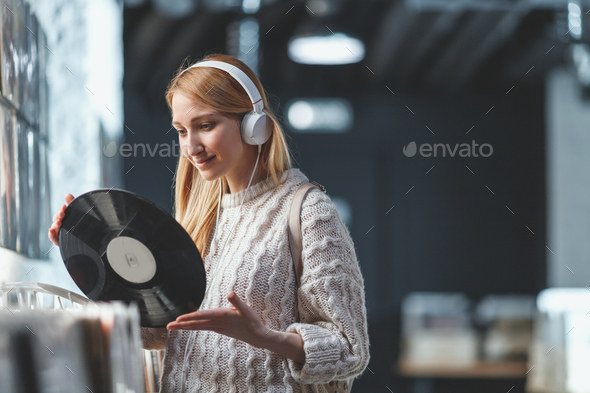 Young girl with a vinyl record Stock Photo by AboutImages | PhotoDune