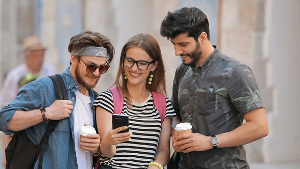 Students Look at Pictures on Phone