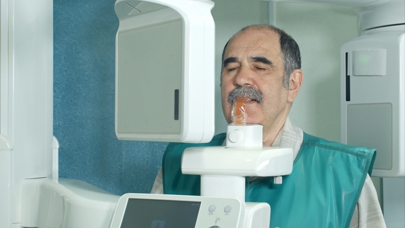 Senior Patient Doing Examination of Teeth By Using Panoramic and Cephalometric X-Ray Scanner alt
