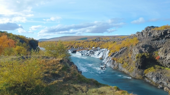 Moving Shot of Hraunfossar Waterfall in Western of Iceland in Autumn Sunny Day