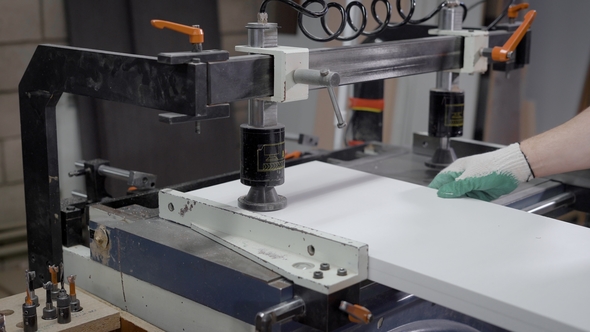  Man Working on a Half-manual Machine on a Furniture Factory. alt