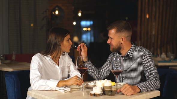 Young Woman Is Feeding His Man Modern Restaurant