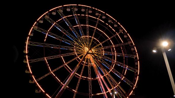Ferris Wheel at Night in the City Batumi, Georgia alt