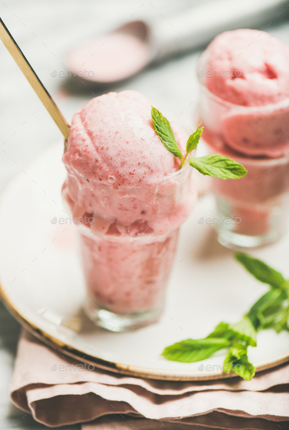 Homemade strawberry yogurt ice cream with mint leaves - Stock Photo - Images