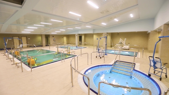 Swimming Pool with Sports Equipment in the Water alt