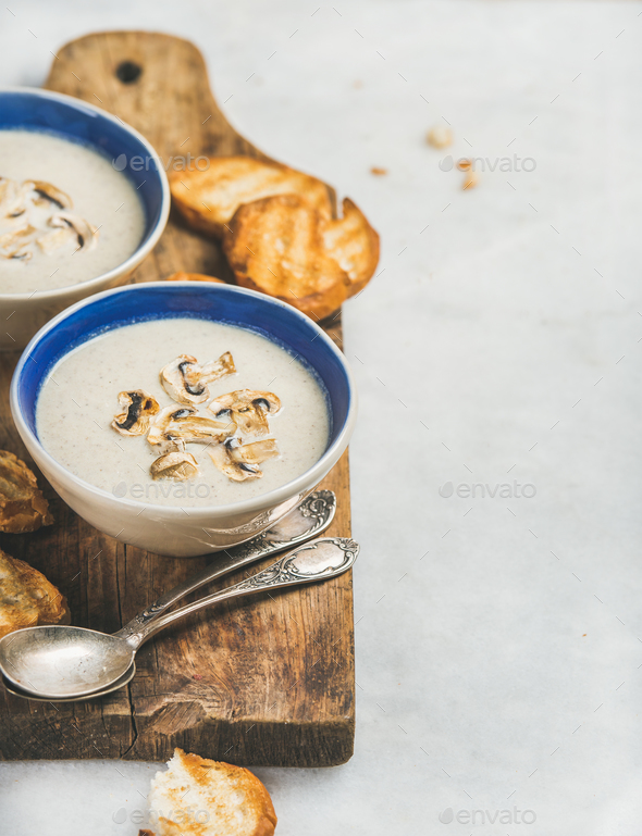 Healthy dinner with creamy mushroom soup and toasted bread - Stock Photo - Images