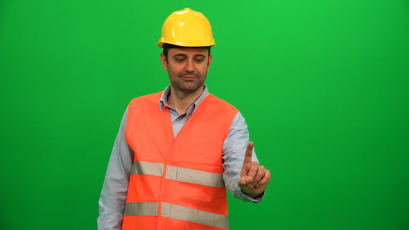 Engineer Man Touching Virtual Monitor on Green Screen alt