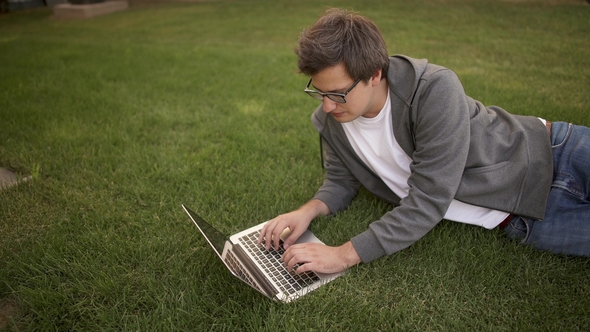 Handsome Businessman Typing on His Laptop