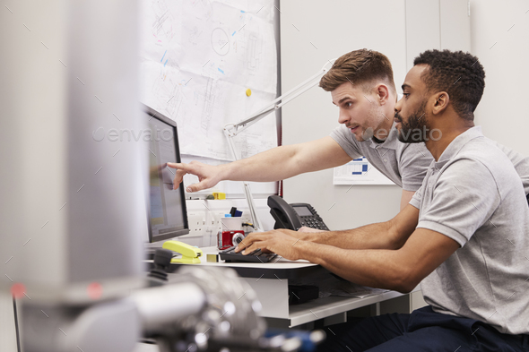 Male Engineers Use CMM Coordinate Measuring Machine In Factory Stock Photo by monkeybusiness