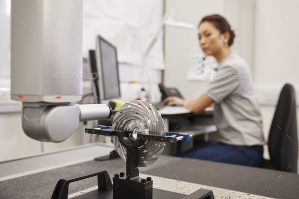 Female Engineer Uses CMM Coordinate Measuring Machine In Factory