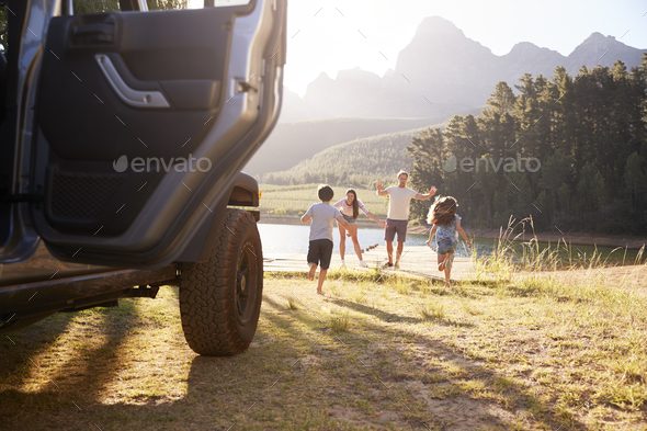 Excited Family Reaching Countryside Destination On Road Trip Stock Photo by monkeybusiness