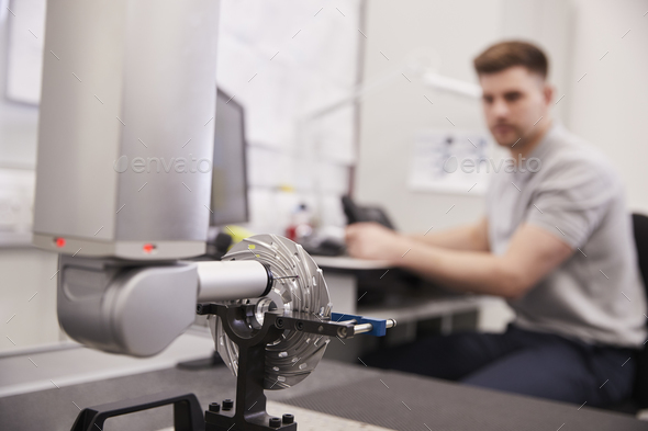Male Engineer Uses CMM Coordinate Measuring Machine In Factory Stock Photo by monkeybusiness