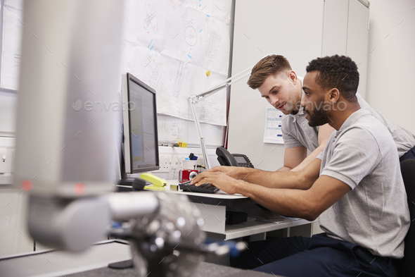 Male Engineers Use CMM Coordinate Measuring Machine In Factory Stock Photo by monkeybusiness