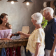 Senior Customers Buying Goods In Store Using Contactless Payment - $5.00 Senior Customers Buying Goods In Store Using Contactless Payment