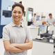 Portrait Of Female Engineer On Factory Floor Of Busy Workshop - $5.00 Portrait Of Female Engineer On Factory Floor Of Busy Workshop