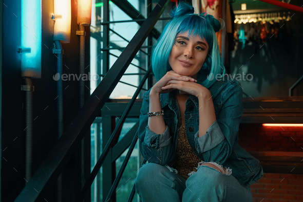 Girl portrait with stylish blue hair and pretty face expression - Stock Photo - Images