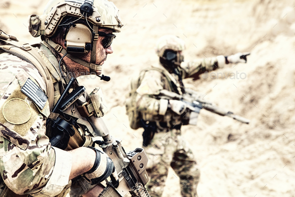 Special reconnaissance team members in desert area Stock Photo by Getmilitaryphotos