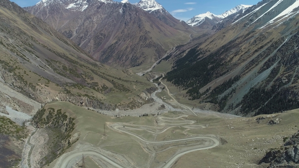 Curvy Serpentine Road Pass in High Mountains alt