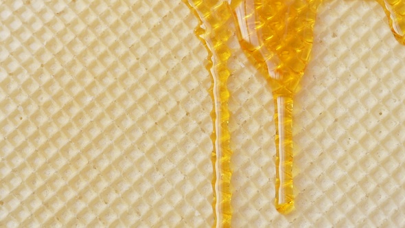 Natural Honey Pours On The Wafer