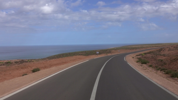 View From Car Driving on Road Along Atlantic Coast alt