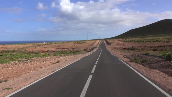 View From Car Driving on Road Along Atlantic Coast alt