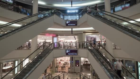 Timelapse of People on Escalators in Shopping Centre alt