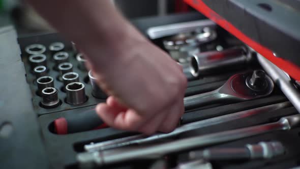 Closeup Hands of Unrecognizable Worker Man Opening Toolbox with Auto Car Tools Taking and Connecting alt