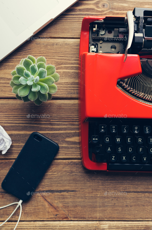 Vintage typewriter on wooden background Stock Photo by KonstantinKolosov