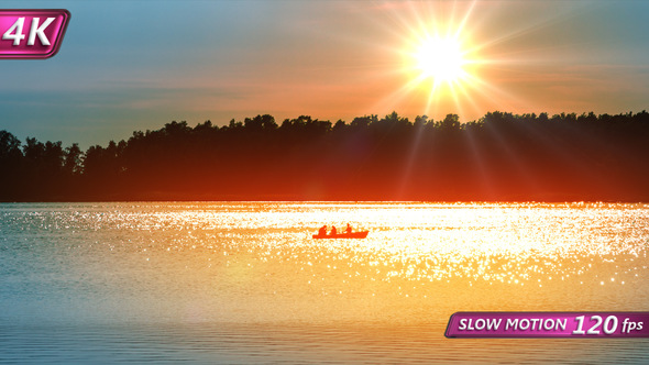 Fishermen in the Boat on the Sunset