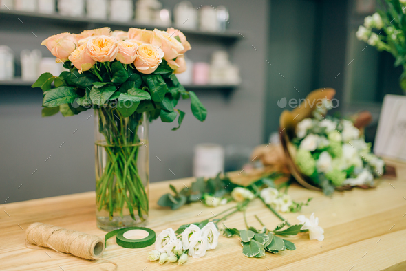 Fresh rose bouquet composition in flower boutique Stock Photo by NomadSoul1