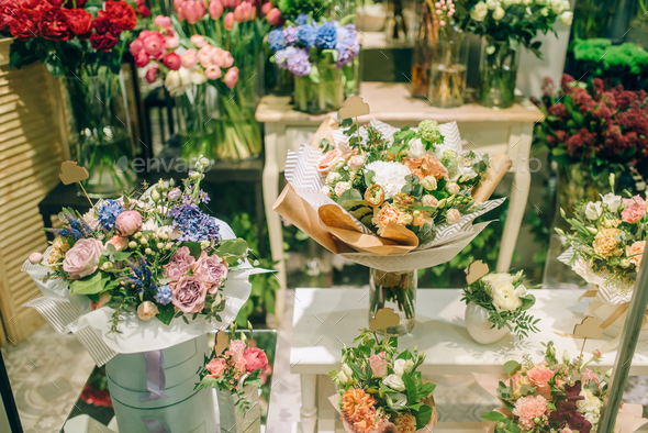 Fresh bouquets arrangement in flower boutique Stock Photo by NomadSoul1