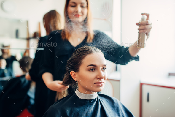 Hairdresser works with hair spray, hairdressing Stock Photo by NomadSoul1