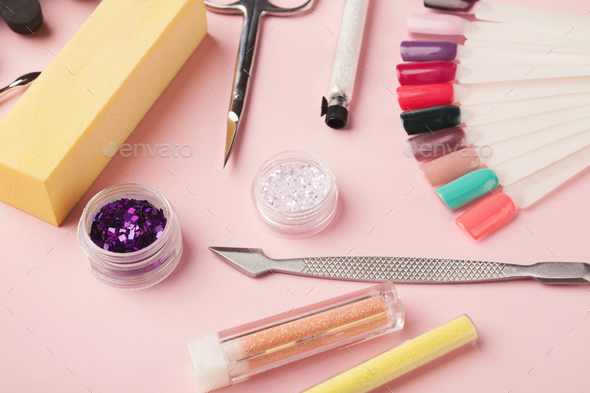 Manicure supplies on pink background Stock Photo by Prostock-studio