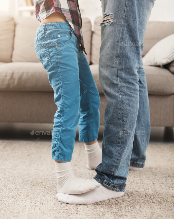 Dad and little daughter dancing together, crop Stock Photo by Prostock-studio
