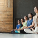 Young women and men in yoga class, relax meditation pose Stock Photo by  Prostock-studio