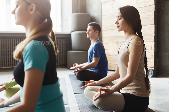 Young man practicing yoga, relax meditation pose Stock Photo by  Prostock-studio