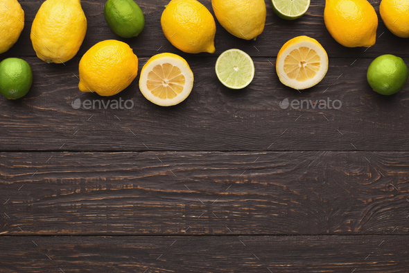 Variety of ripe citruses on wooden background Stock Photo by Prostock-studio