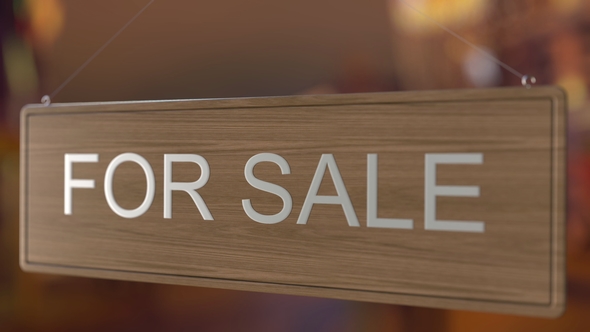 Door Sign Is Turned Over From FOR SALE To SOLD alt