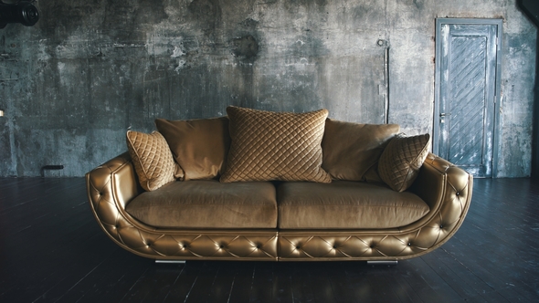 Luxury Golden Sofa on a Loft Background