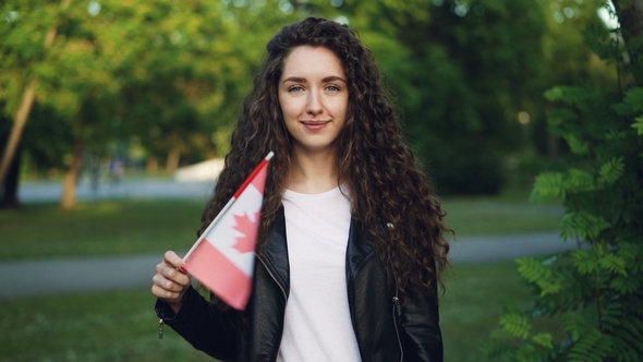 Portrait of Happy Canadian Sports Fan Waving National Flag, Stock Footage