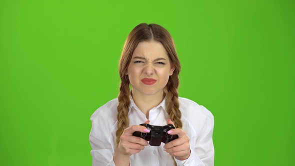 Gamer Girl Is Holding a Joystick Green Screen, Stock Footage | VideoHive