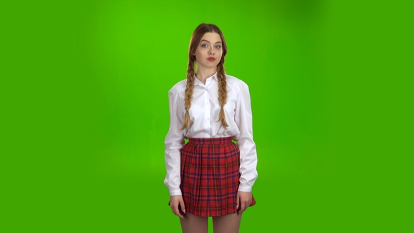 Teen Shows a Ok Smiling . Green Screen alt