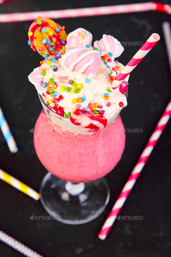 Pink Extreme milkshake with berry rasberry Stock Photo by bondarillia