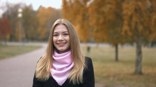 Portrait of Girl in Autumn Park