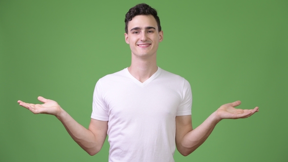 Young Handsome Man Choosing Between Left and Right alt