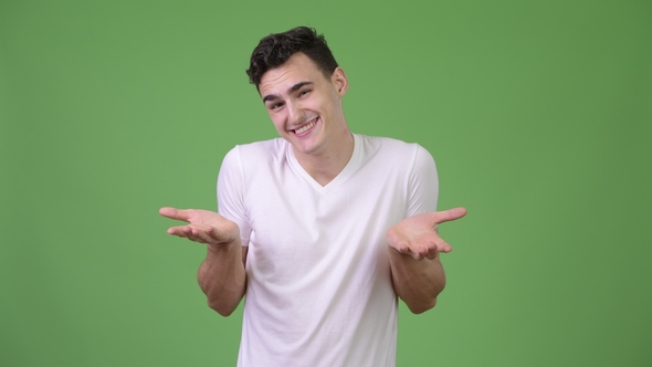 Young Handsome Man Shrugging Shoulders alt