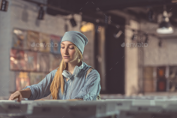 Attractive girl in a music store Stock Photo by AboutImages | PhotoDune