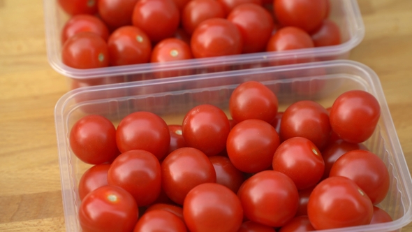 Red Cherry Tomatoes Rotating on a Plate.
