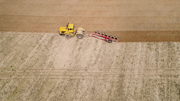 Aerial Footage of a Tractor on a Field